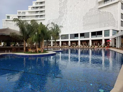a large swimming pool in front of a building at Grand Saphire Resort Apartment-I in İskele