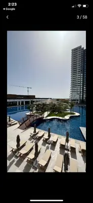 a group of chaise lounges in a pool at Grand Sapphire Resort in Aglantzia