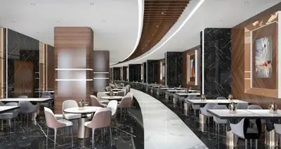 a restaurant with tables and chairs in a room at Grand Sapphire Resort in Aglantzia