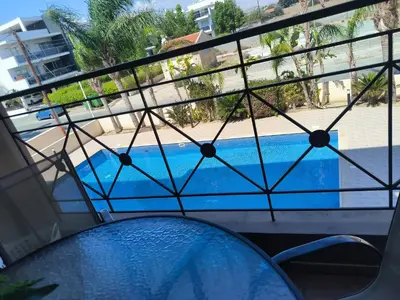 a view of a swimming pool from a balcony at 2 Bed Apartment in Kiti with Communal Pool in Kiti
