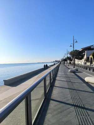 a walkway next to the water on a beach at 2 Bedroom Brand New Apartment Mc Kenzie 2 minute to the Mc Kenzie Beach in Larnaka