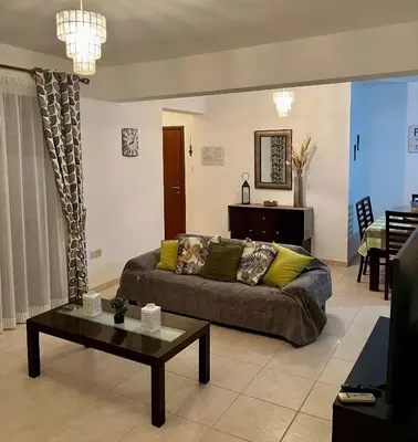 a living room with a couch and a table at 2 Bedroom Penthouse Apartment in Oroklini with Communal Pool in Voroklini