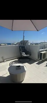 a balcony with a chair and a toilet on a ship at MERAKI Villa in Paralimni
