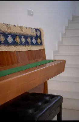 a close up of a wooden bench next to some stairs at MERAKI Villa in Paralimni