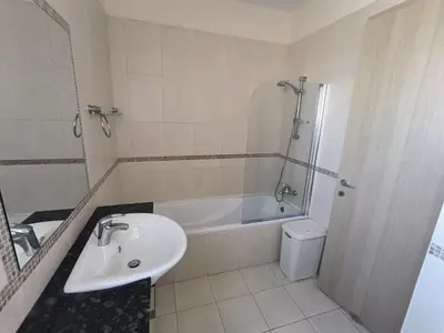 a bathroom with a sink and a tub and a toilet at Superior 1 bed apartment in Oroklini with Communal Pool in Voroklini