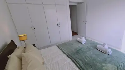 a bedroom with a bed with two towels on it at STAY Virtuoso Apartment in Nicosia