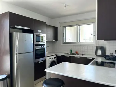 a kitchen with a stainless steel refrigerator and a dishwasher at Cozy Stay Nicosia in Nicosia