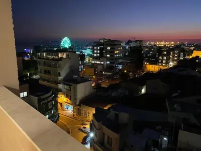 a view of a city at night with at Limassol Marina Seaview Suite in Limassol