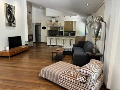 a living room with a couch and a table at 3 Bedroom Oceanfront Oasis for Memorable Vacations in Voroklini