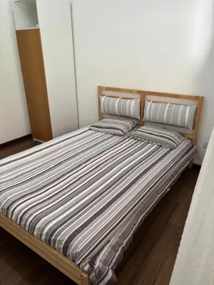 a bed with two pillows on it in a room at 3 Bedroom Oceanfront Oasis for Memorable Vacations in Voroklini