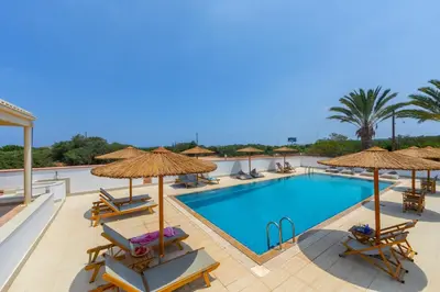 a pool with chairs and umbrellas at a resort at Protaras Views Villa PRAM1 in Protaras