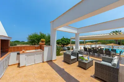 an outdoor entertaining area with a patio with tables and chairs at Protaras Views Villa PRAM1 in Protaras