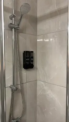 a shower in a bathroom with a glass door at Casi-Homes in Larnaka