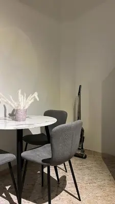 a table with two chairs and a white table and a table and chairs at Casi-Homes in Larnaka