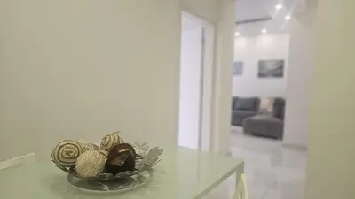 a bowl of yarn sitting on a glass table at STAY Finibreeze Apartment in Larnaka