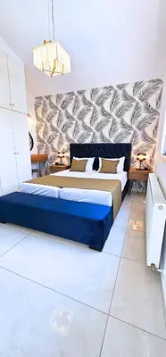a bedroom with a large blue bed in a room at Villa Elia Blue , hot tube , heated pool in Paralimni