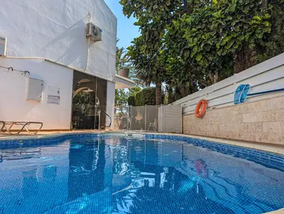 a large blue swimming pool in a house at Fig Tree Bay Villa Elena in Protaras