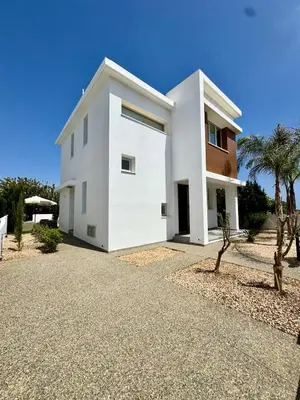 a white house with palm trees in front of it at Villa Jarvis Modern and Quiet 3BR with Private Swimming Pool in Paralimni