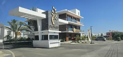 a building with a sign for a hotel at Modern Luxury Apartment in Aglantzia