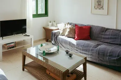 a living room with a couch and a coffee table at Mediterraneo 27 - Protaras in Protaras