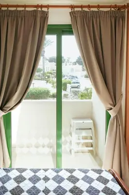 a bedroom with a bed and a window at Mediterraneo 27 - Protaras in Protaras