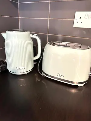 a white toaster and a toaster on a counter at Serene Getaway Near Protaras in Paralimni