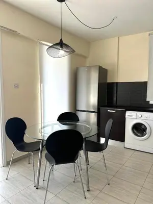 a dining room with a glass table and chairs at Serene Getaway Near Protaras in Paralimni