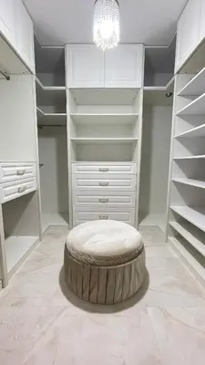 a white closet with a stool in the middle at Kingdom Villa with Sauna and Hamam in Kaimakli