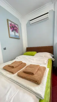 a bedroom with a bed with towels on it at Kingdom Villa with Sauna and Hamam in Kaimakli