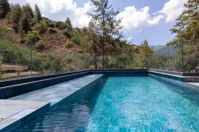 a swimming pool with a view of a mountain at Kakopetria Luxury Villa w pool in Kakopetria
