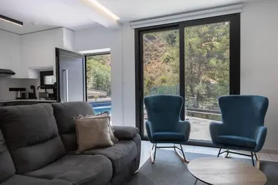 a living room with a couch and two chairs at Kakopetria Luxury Villa w pool in Kakopetria