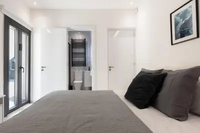 a bedroom with a large bed and a window at Kakopetria Luxury Villa w pool in Kakopetria