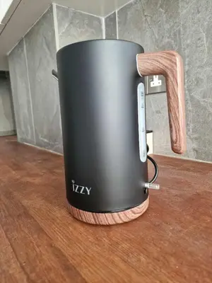 a toaster sitting on top of a wooden table at Cosy 2-Bedroom Apartment, 10 Minutes from the Beach in Larnaka