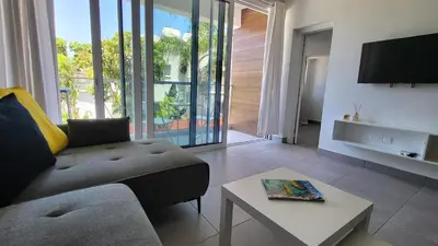 a living room with a couch and a table at Hanapartment 3 bed Ayia NAPA in Ayia Napa