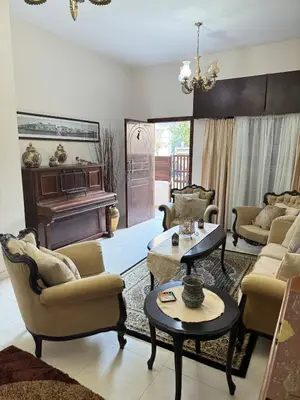 a living room filled with furniture and a piano at 2 bedroom apartment 50 meters from the sea in Limassol