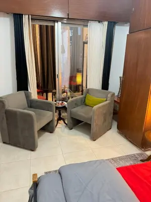 a living room with two chairs and a couch at 2 bedroom apartment 50 meters from the sea in Limassol