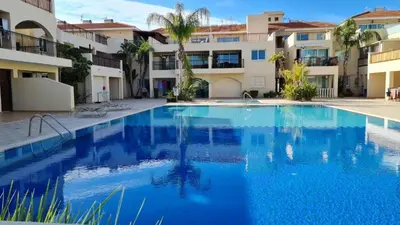a large swimming pool in front of a building at Pool flat near Ayia Napa in Sotira