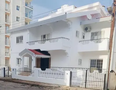 a white building with balconies on the side of it at Heritage Villas Northern Cyprus in Mağusa