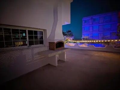 a building with a brick fireplace and a building with lights at Heritage Villas Northern Cyprus in Mağusa