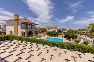 an exterior view of a house with a swimming pool at Ayia Napa Luxury Seaside Villa Ionion H15 in Ayia Napa