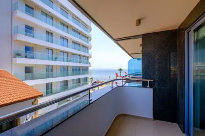 a balcony with a view of the ocean at Downtown Finikoudes Beach Apartment in Larnaka