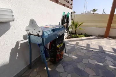 a blue ping pong table sitting next to a building at Maouris Villa in Protaras
