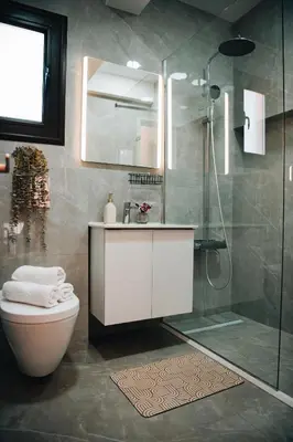 a bathroom with a shower and a toilet and a sink at Villa Lela in Paralimni