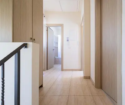 an empty hallway with a staircase in a building at Maestro Villa II - Pervolia in Pervolia