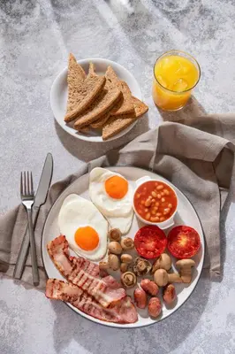 a plate of breakfast food with eggs beans and toast at Urban Condo 10th Floor - 2 Bdr in Nicosia