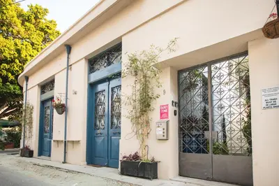 a building with blue doors on a street at Atelier Residences by Sweet Keys in Limassol