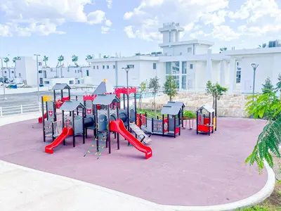 a playground with a slide in a park at Awaken Your Hidden Goddess Retreat at Nissi Avenue - Central Ayia Napa in Ayia Napa