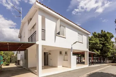 a white house with a courtyard at Larnaca Seaside Villa Marina 43 in Pervolia