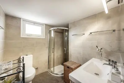 a bathroom with a toilet and a sink and a shower at Larnaca Seaside Villa Marina 44 in Pervolia
