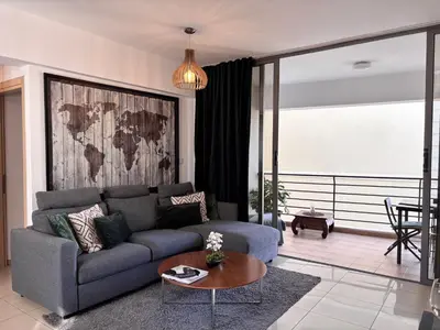 a living room with a couch and a table at Makriev Suite in Larnaka